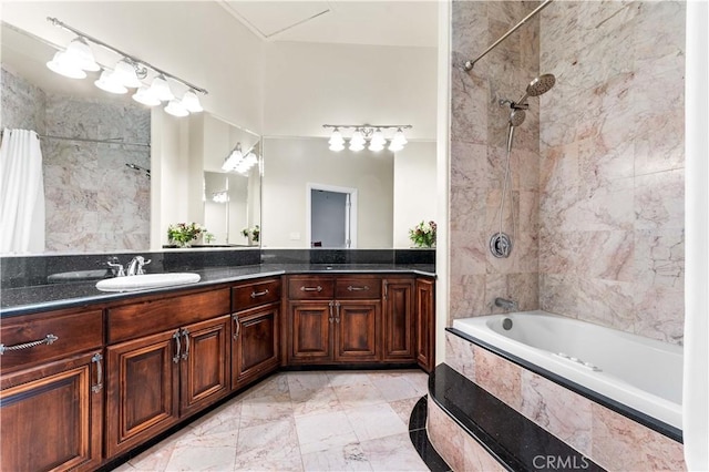 bathroom featuring vanity and tiled shower / bath