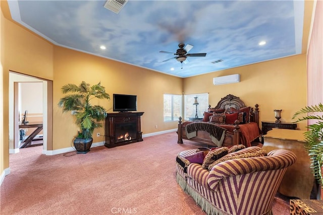 bedroom with carpet floors, a wall unit AC, and ceiling fan