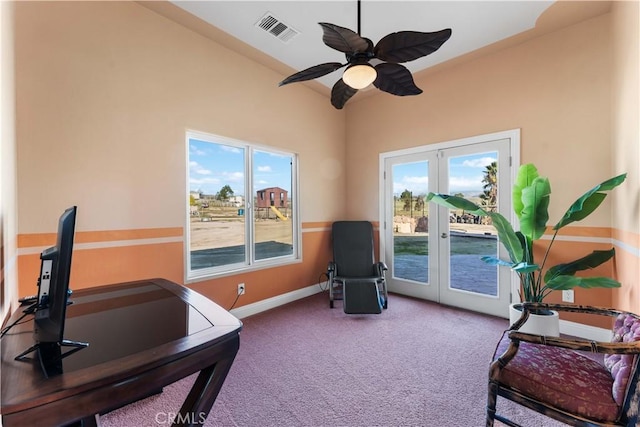 interior space with carpet flooring, ceiling fan, and french doors