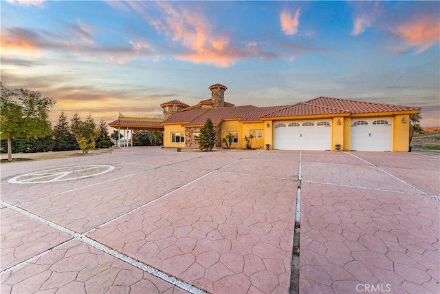 mediterranean / spanish-style home featuring a garage