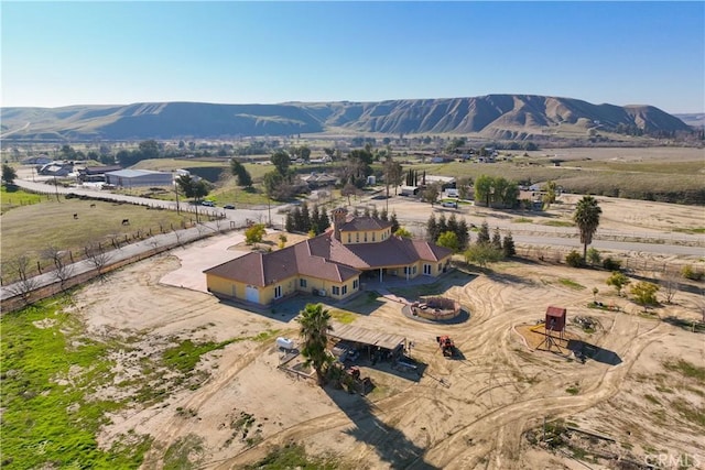 birds eye view of property with a mountain view