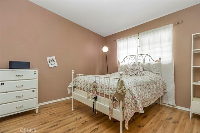 bedroom with light wood-type flooring