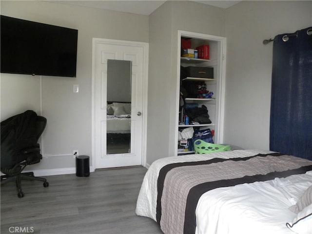 bedroom with hardwood / wood-style flooring