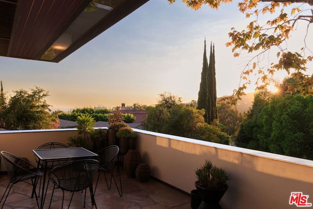 view of balcony at dusk