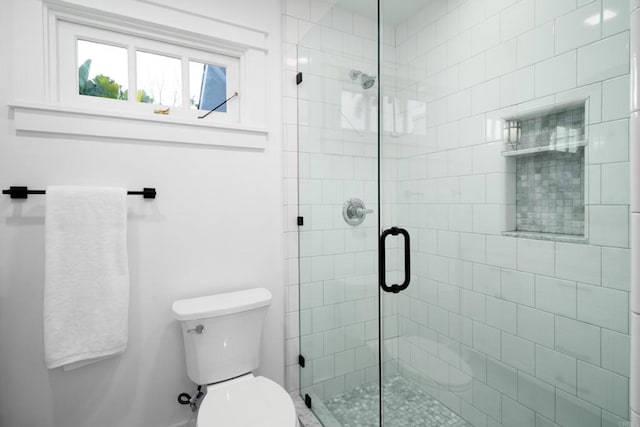 bathroom with walk in shower and toilet