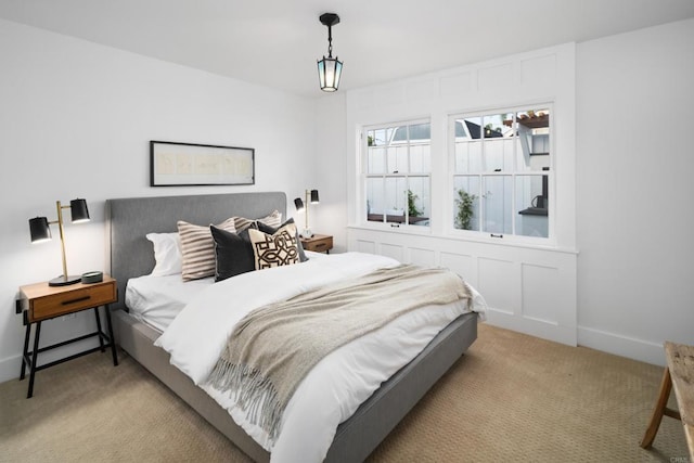 bedroom with light colored carpet