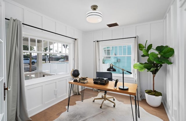 home office featuring light hardwood / wood-style floors