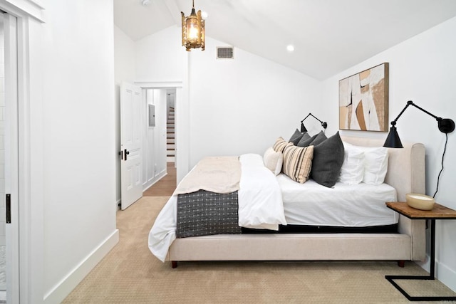 bedroom with lofted ceiling