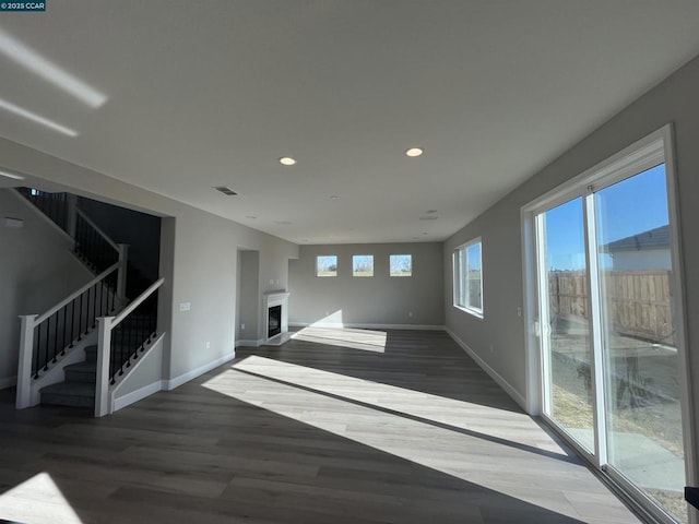 unfurnished living room featuring wood-type flooring