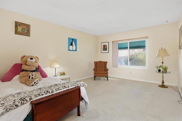 bedroom featuring baseboards and carpet flooring