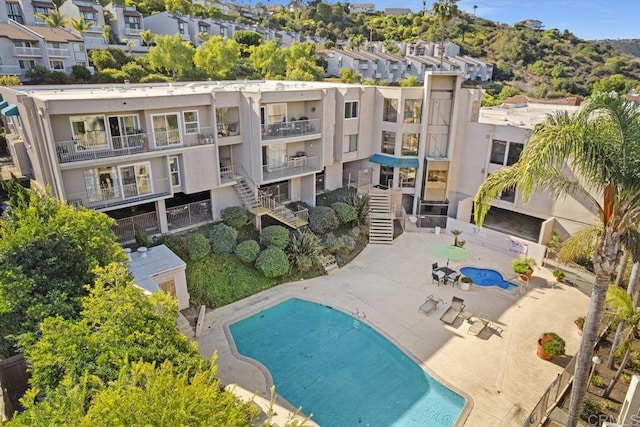 exterior space with a residential view and a patio