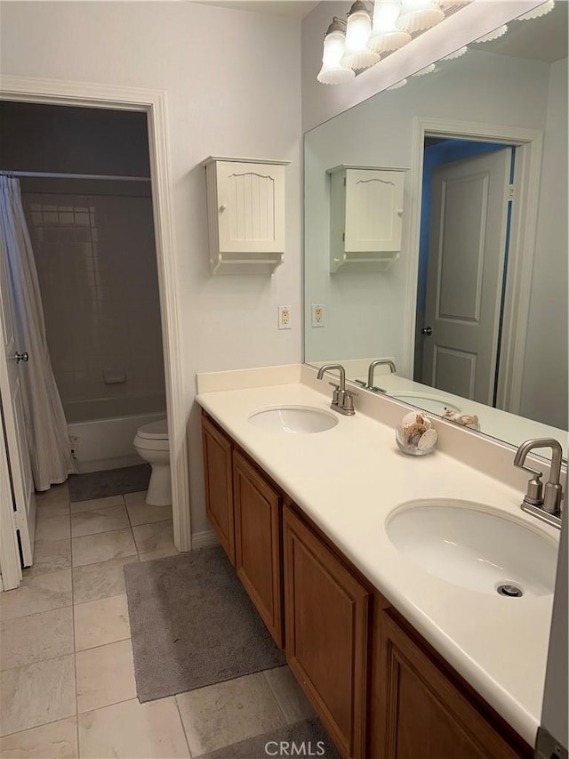 full bathroom featuring vanity, shower / bath combination with curtain, and toilet