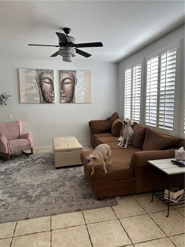 living room featuring a textured ceiling and ceiling fan