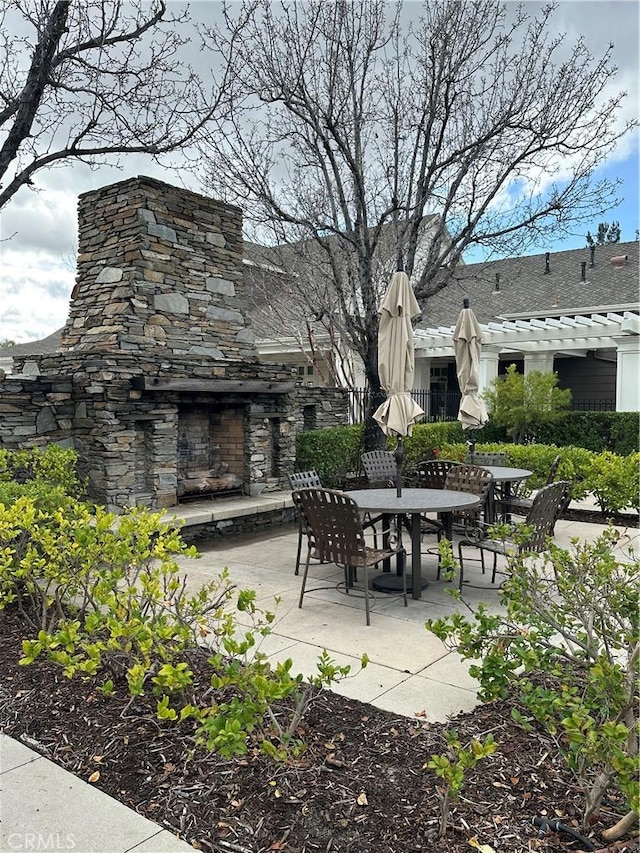 23346 Clearwater Ln, Valencia, CA 91355 - view of patio with an outdoor stone fireplace