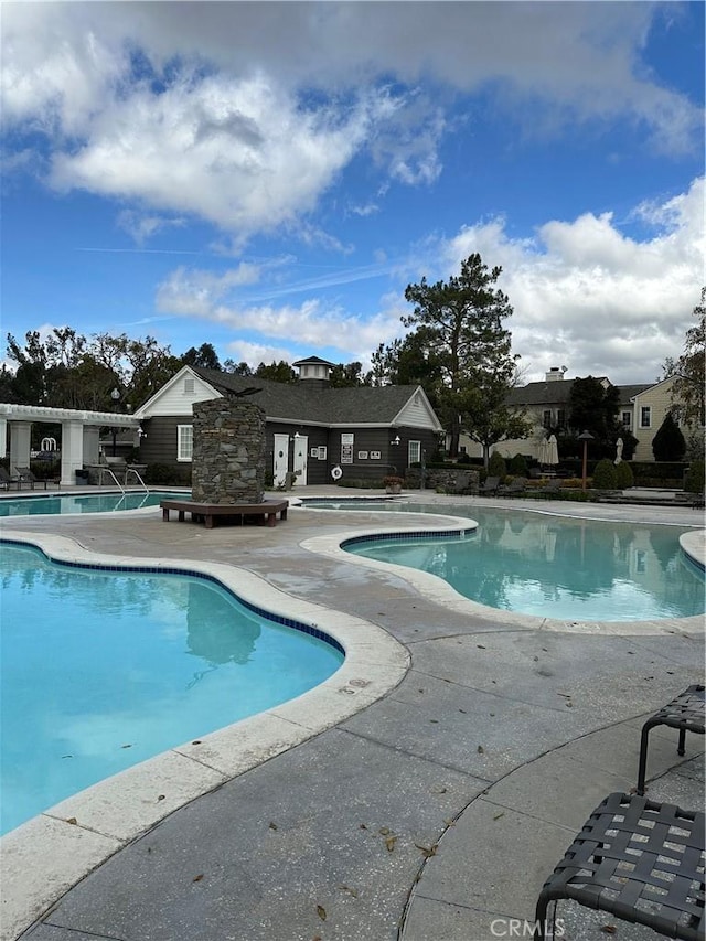 23346 Clearwater Ln, Valencia, CA 91355 - view of swimming pool with a patio area