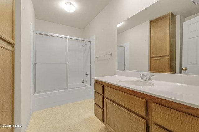 bathroom featuring vanity and shower / bath combination with glass door