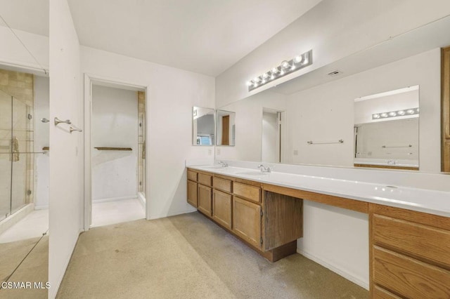 bathroom featuring vanity and an enclosed shower