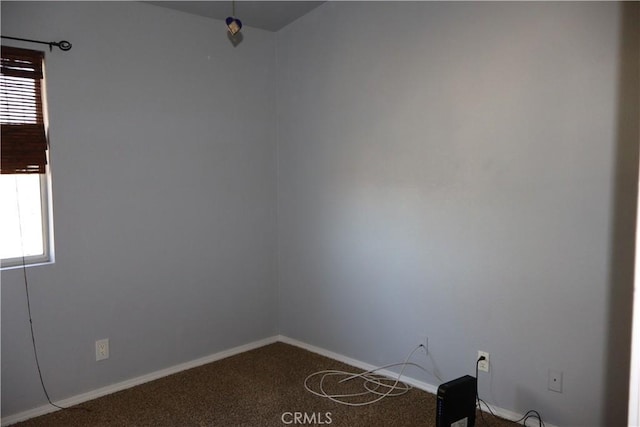 carpeted empty room featuring plenty of natural light