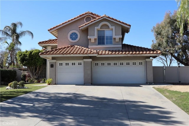 mediterranean / spanish home featuring a garage