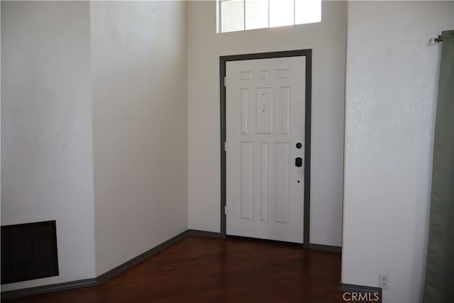 entrance foyer with dark hardwood / wood-style floors