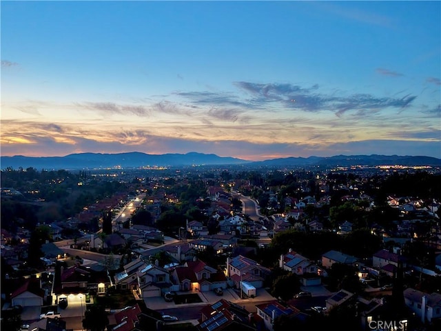 aerial view at dusk with a mountain view