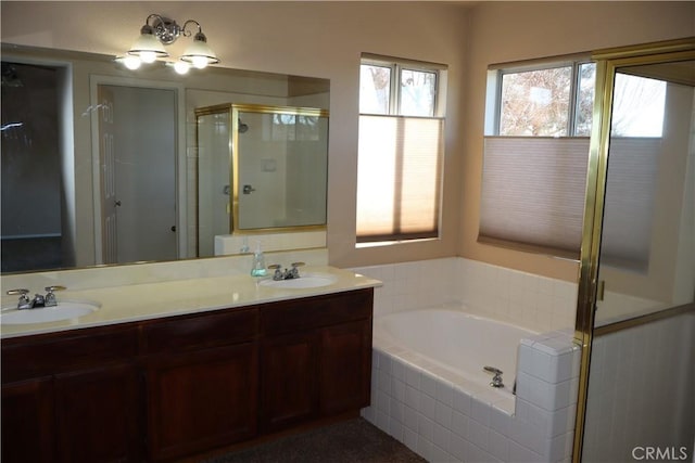 bathroom with vanity and independent shower and bath