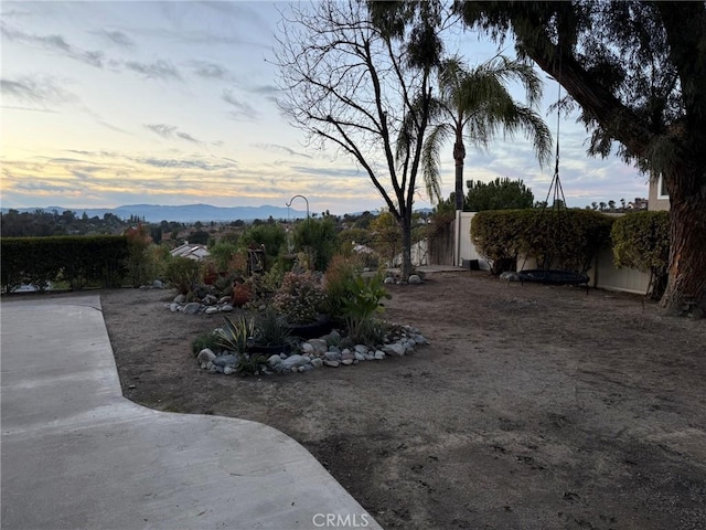 yard at dusk with a mountain view