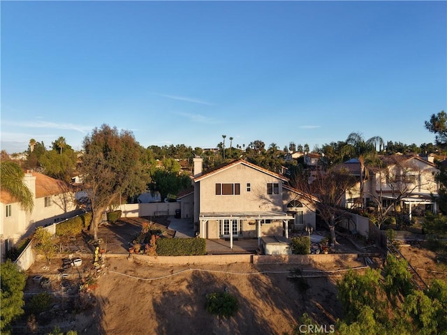 back of property featuring a patio