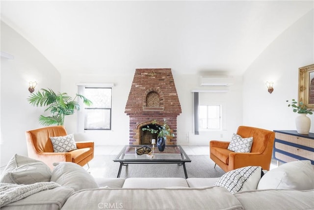 living room featuring lofted ceiling, a wall mounted AC, a brick fireplace, and a wealth of natural light