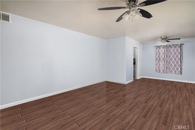 unfurnished room with dark hardwood / wood-style floors and ceiling fan