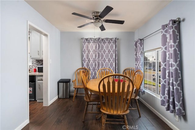 dining room with dark wood-type flooring and ceiling fan