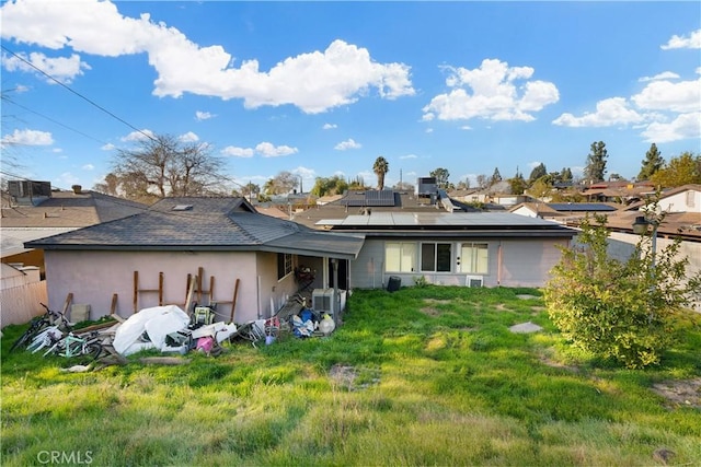 rear view of house with solar panels