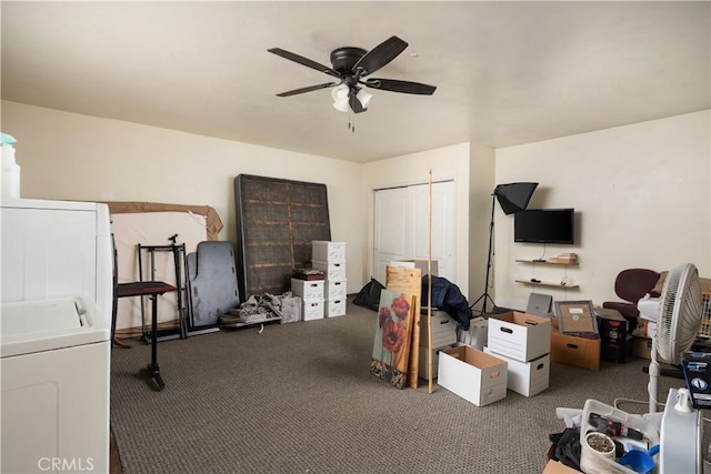 interior space featuring washer / clothes dryer, ceiling fan, and carpet flooring