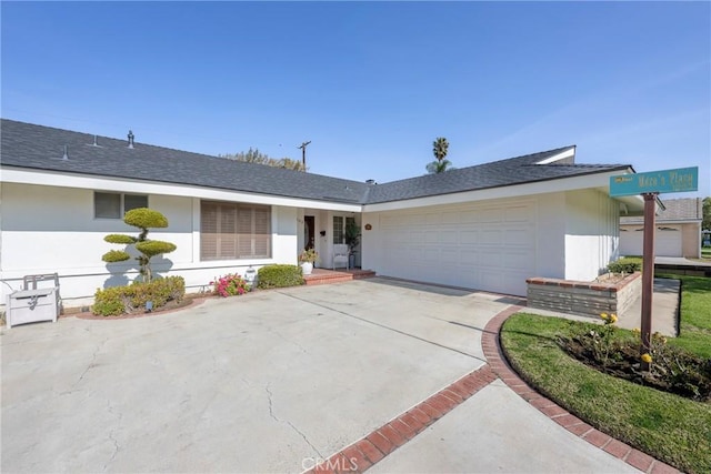 ranch-style home featuring a garage