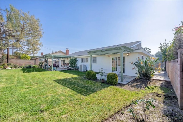 back of property with a patio, a yard, central AC unit, and a pergola