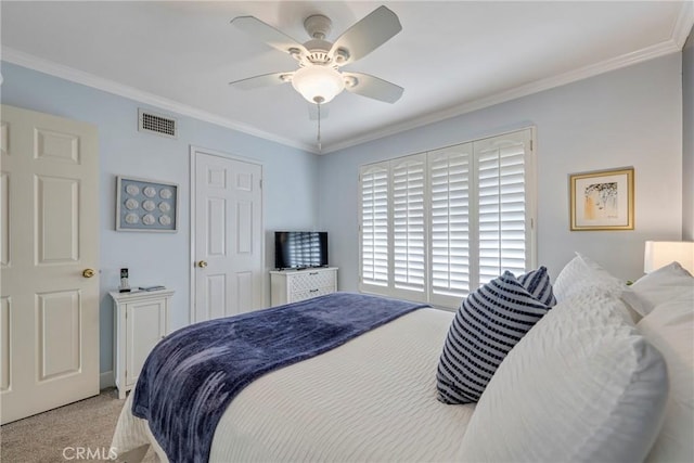 carpeted bedroom featuring ornamental molding and ceiling fan