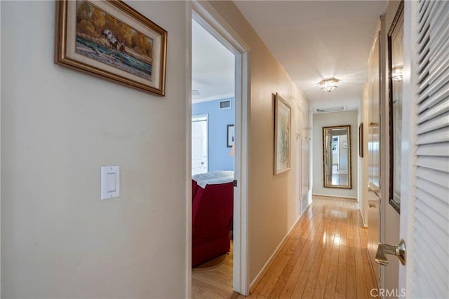 corridor featuring light hardwood / wood-style floors