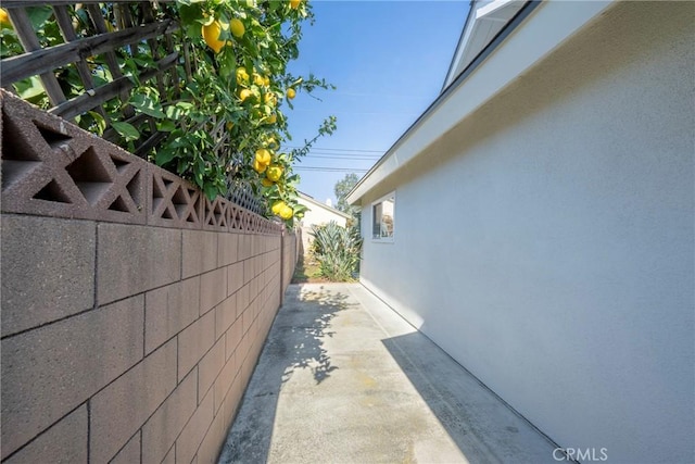 view of side of property with a patio area