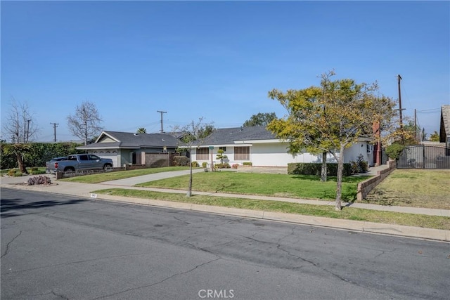 single story home featuring a front yard