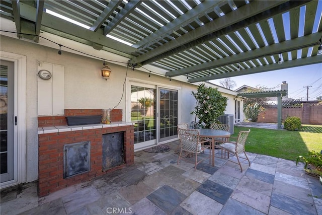 view of patio with exterior kitchen, a pergola, and central air condition unit