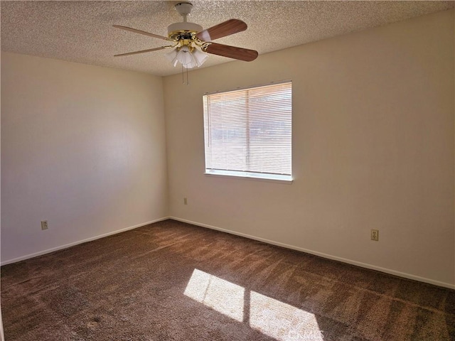 carpeted spare room featuring a ceiling fan, baseboards, and a textured ceiling