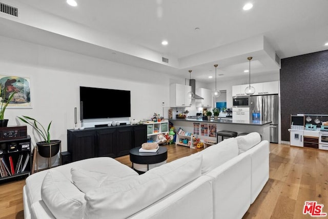 living room with light hardwood / wood-style floors