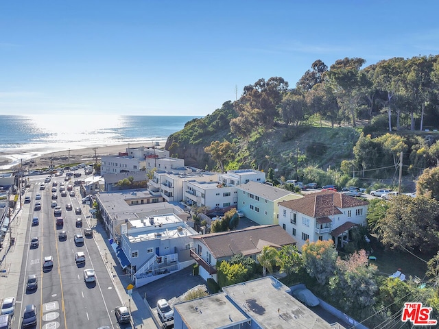 aerial view with a water view and a view of the beach