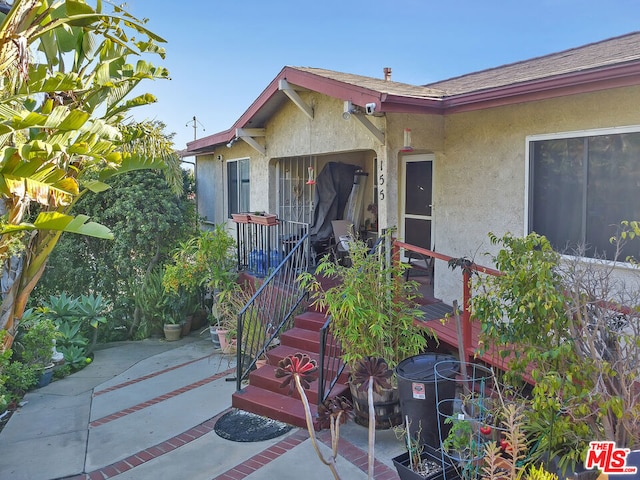 doorway to property featuring a patio