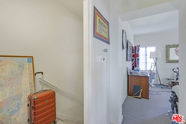 hallway with carpet