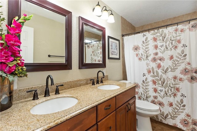 bathroom with vanity, a shower with curtain, and toilet