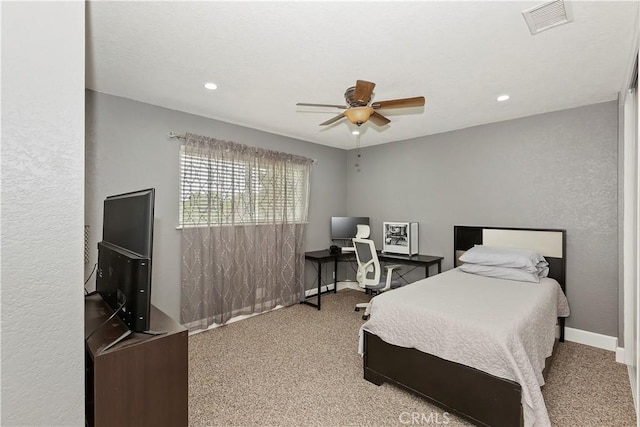 carpeted bedroom with ceiling fan