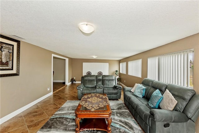 tiled living room with a textured ceiling