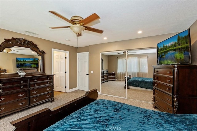 bedroom featuring carpet flooring, ceiling fan, and a closet