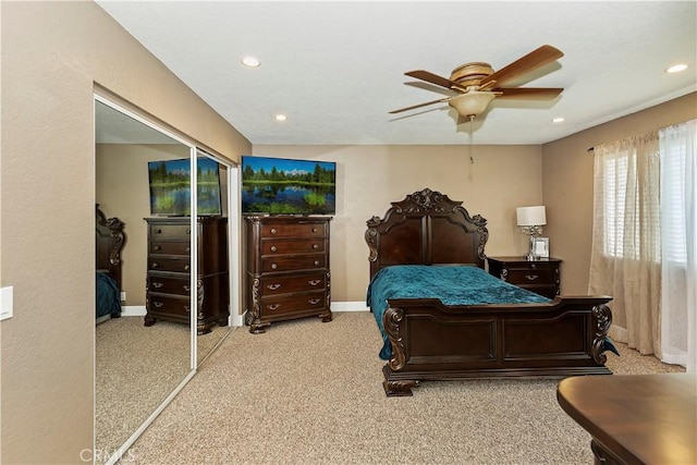 bedroom featuring light colored carpet and ceiling fan